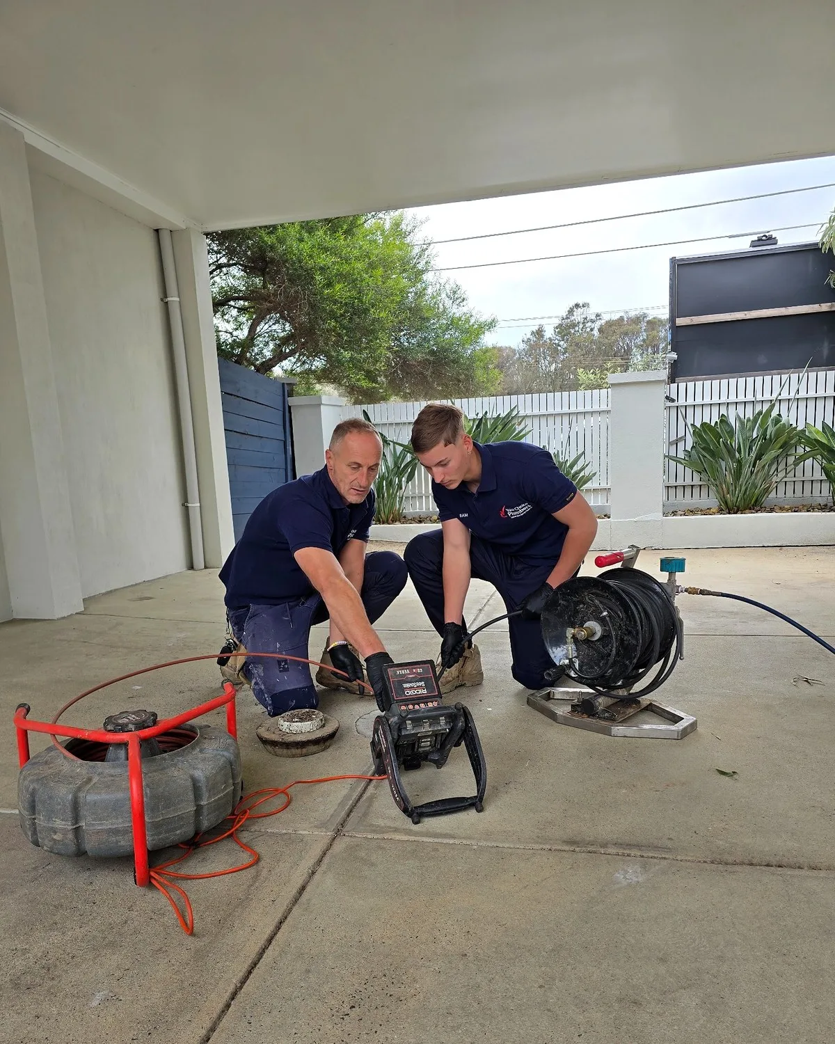 This image shows Your Choice Plumbers carrying out blocked drain diagnosis using a CCTV drain camera together with hydro jetting equipment. It is a strong lead image for the Hydro Jetting page because it shows both the inspection and clearing process in one authentic on-site photo.