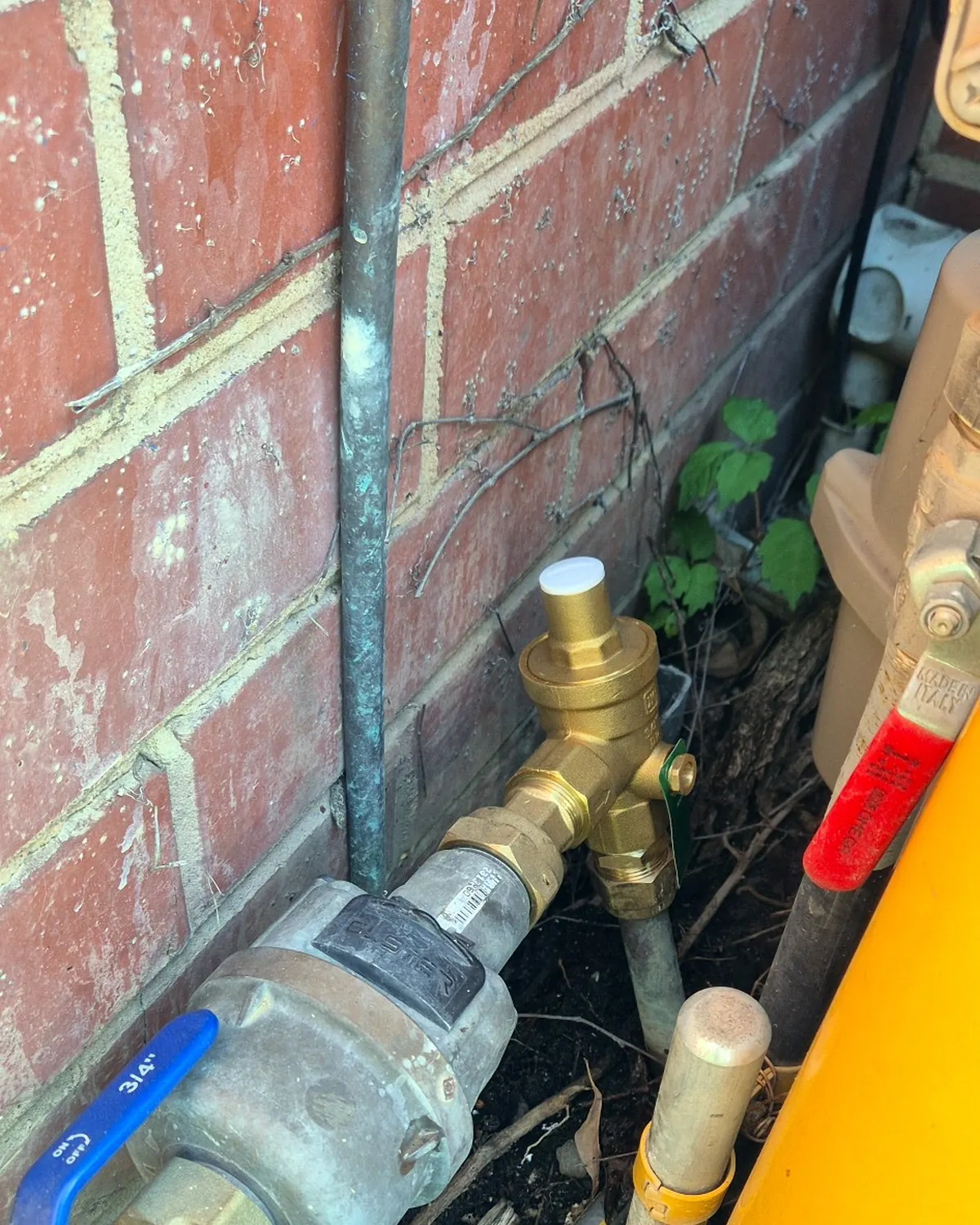 Pressure reducing valve installed at a residential water meter in Ormond.