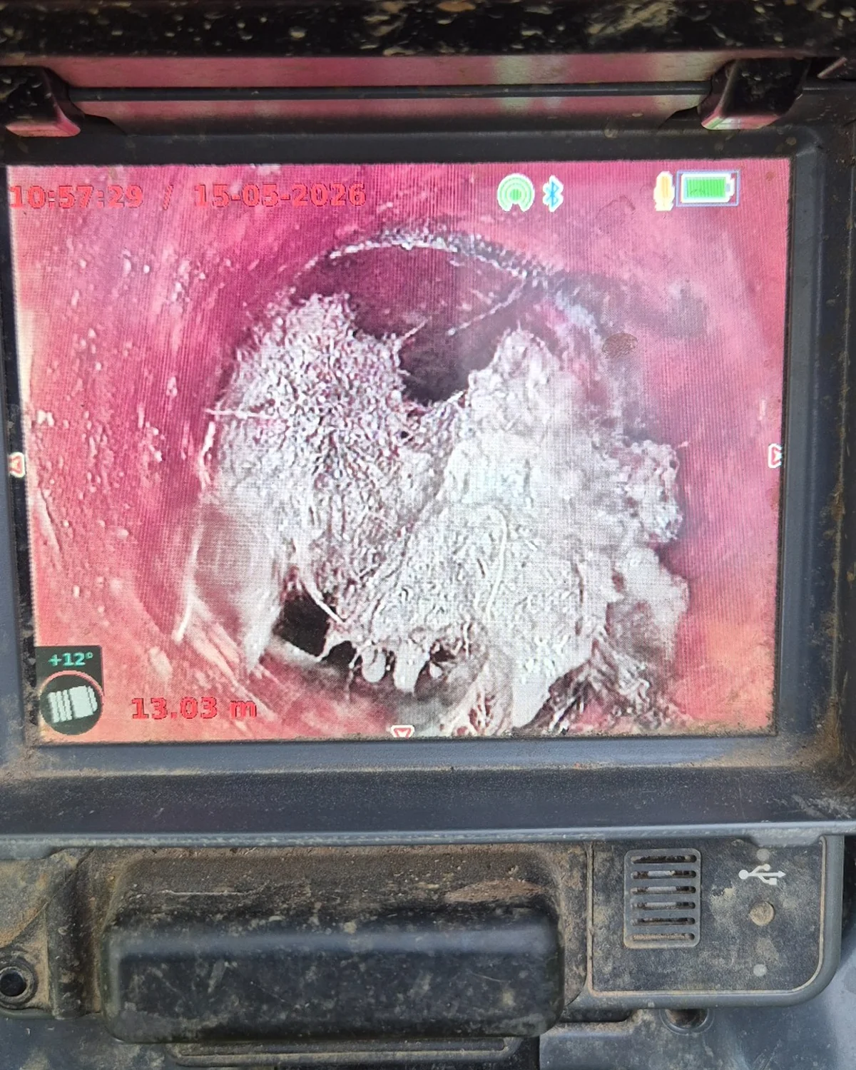 CCTV drain inspection showing severe tree root blockage inside terracotta pipe