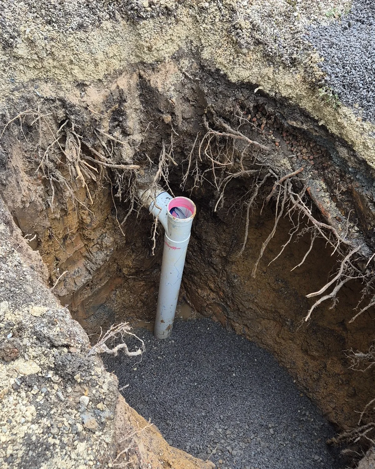 ew PVC sewer pipe and boundary trap installed in a prepared excavation in Toorak.