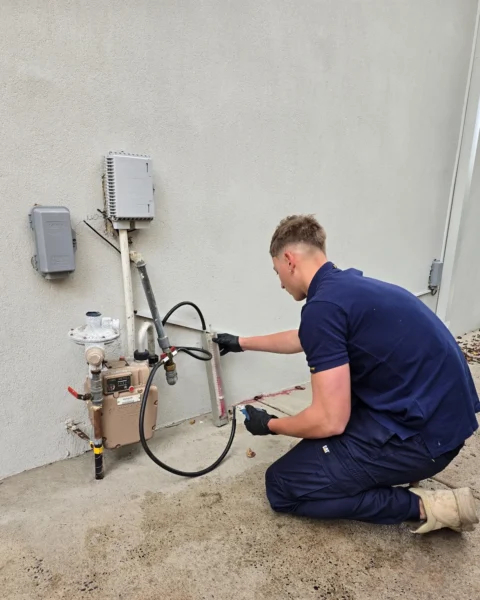 Your Choice Plumbers plumber carrying out a gas pressure test at a client’s gas meter using a manometer.